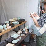 Many tents out at the Selecting an item at the bi-annual pottery fair